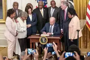 Photo of President Biden signing into law new national holiday: Juneteenth