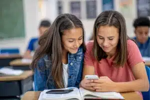 teens on cell phone in school