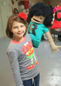 Kaitlyn Anderson with her puppet