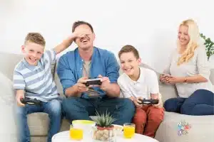 Family having fun and playing video games together on National Video Game Day