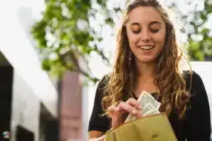 teen looking at her wallet